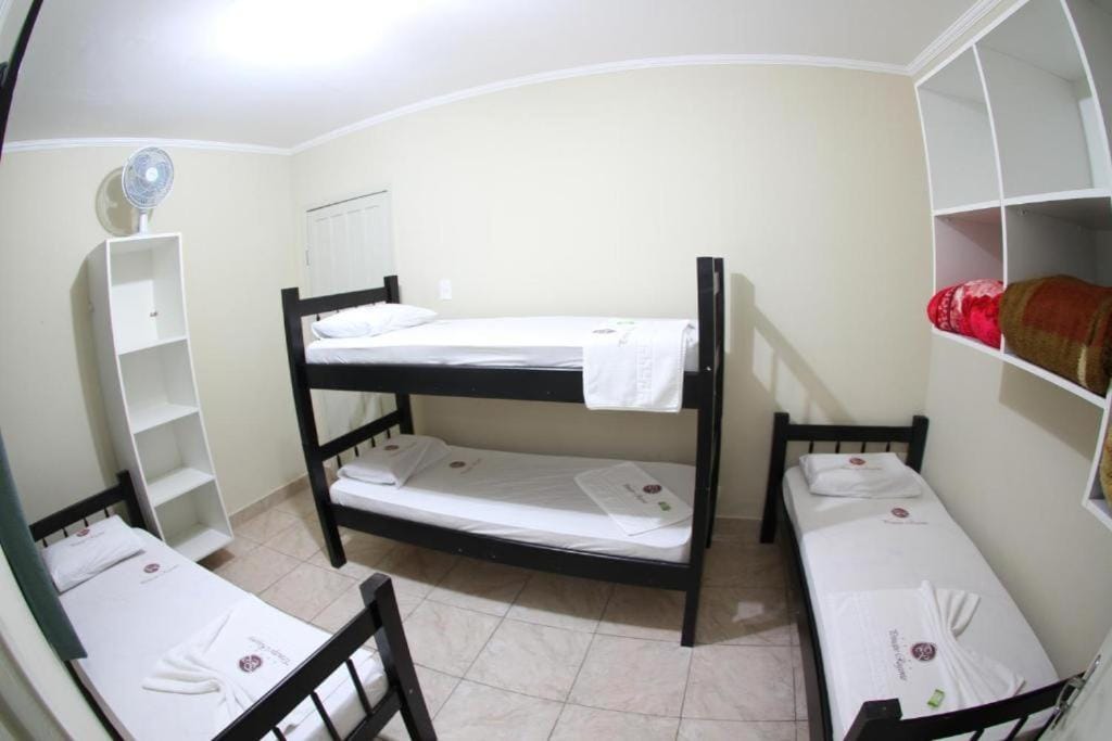 Quarto quádruplo do Hotel Curitibano para grupos e famílias